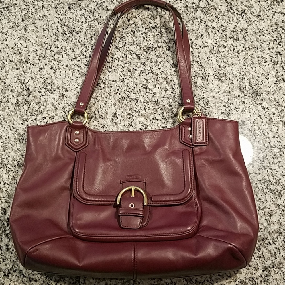 Beautiful dark red and gold Coach purse.